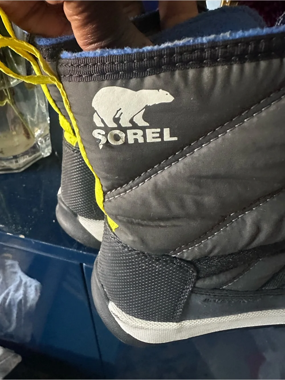 Sorel Kids Black Winter Boots with Blue Laces and Red Accents
